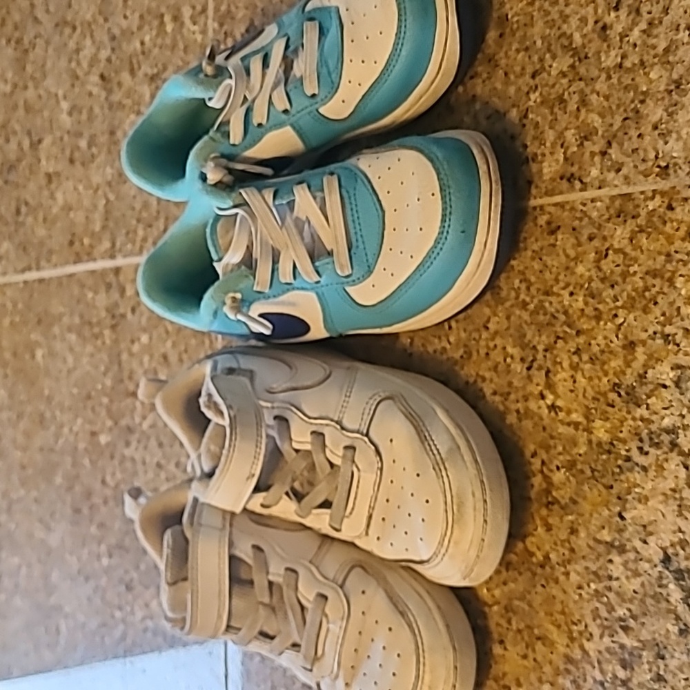 2 pairs of Nikes
